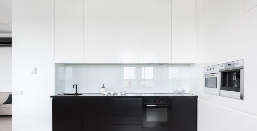 Elegant and simple kitchen with black and white cupboards